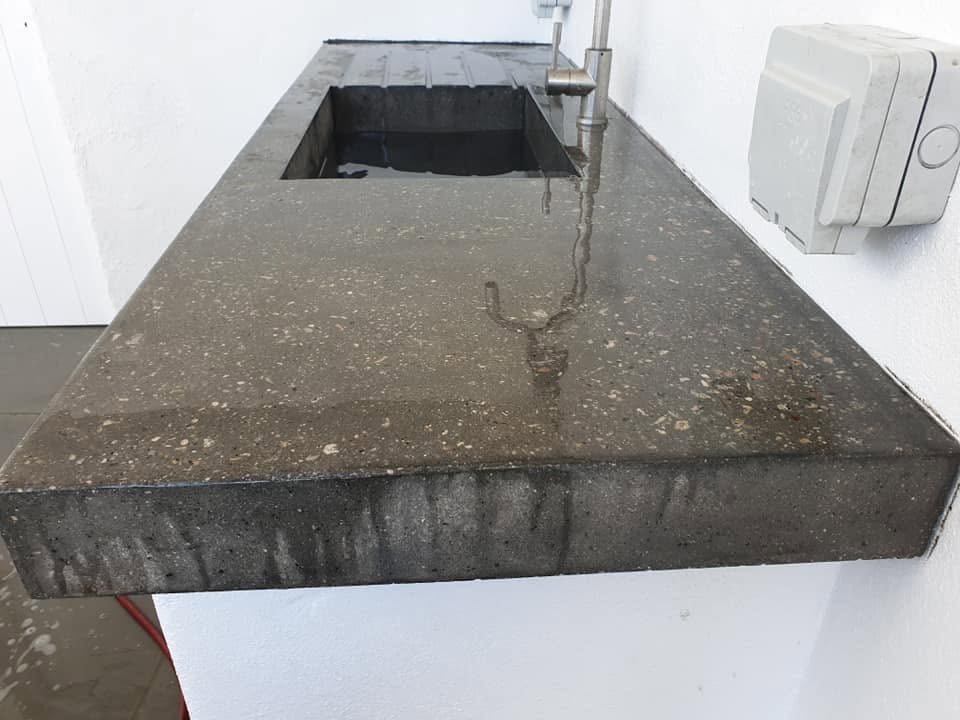 Polished concrete outdoor sink with exposed aggregate